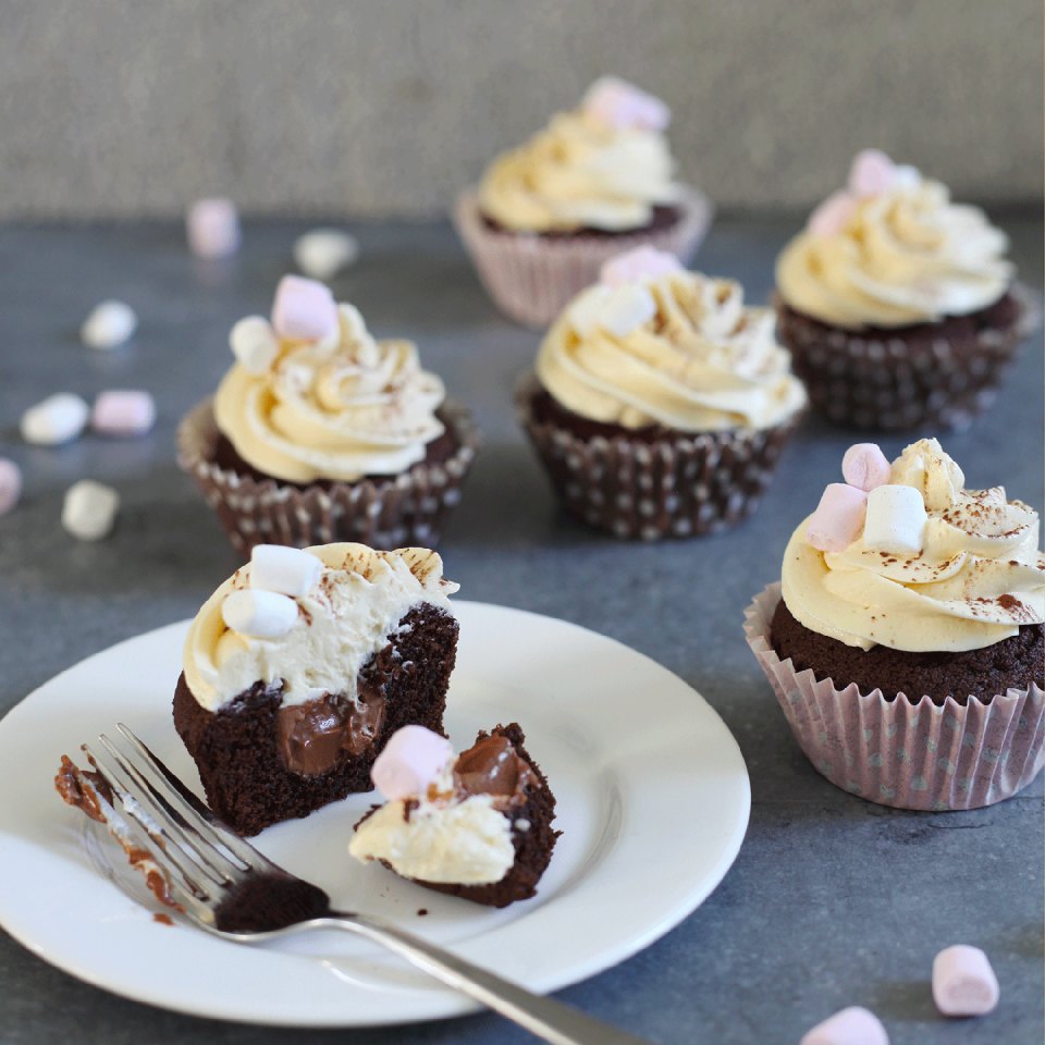 <p>Evoking a decadent cup of hot chocolate, topped with Baileys-spiked whipped cream, these hot chocolate cupcakes have a surprise gooey centre and a rich creamy frosting that is guaranteed to please!</p><p><strong>Recipe: <a href="https://www.goodhousekeeping.com/uk/food/recipes/hot-chocolate-cupcakes" rel="nofollow noopener" target="_blank" data-ylk="slk:Hot chocolate cupcakes" class="link ">Hot chocolate cupcakes</a> </strong><br><br></p>