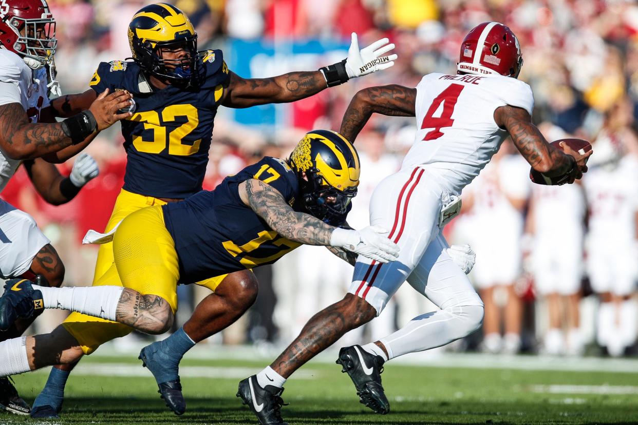 Michigan defensive end Braiden McGregor tackles Alabama quarterback Jalen Milroe during the first half of the Rose Bowl in Pasadena, California, on Monday, Jan. 1, 2024.