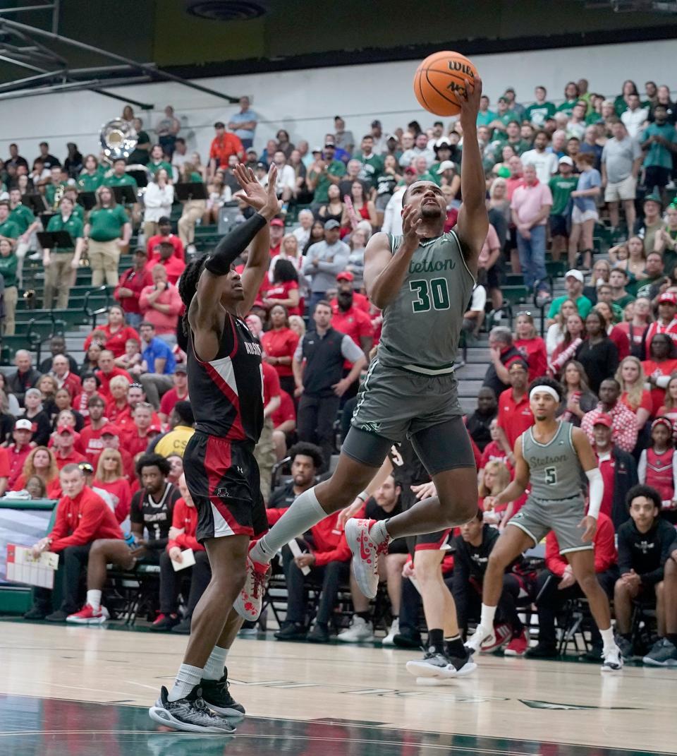 Stetson's Stephan Swenson drives to the basket during the ASUN Championship game at Edmunds Center in DeLand, Sunday, March 10, 2024.