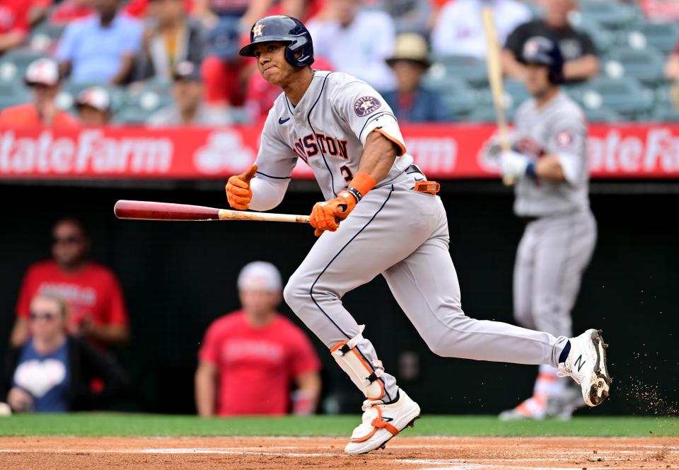 Astros shortstop and Providence native Jeremy Pena hits a double during a game against the Los Angeles Angels on April 10.