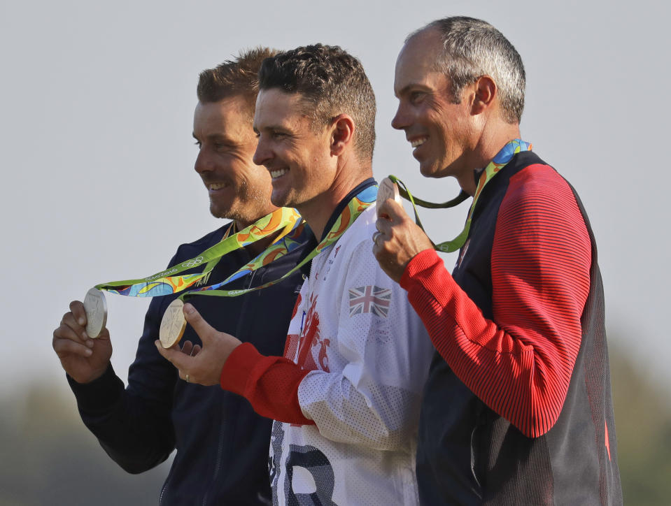 FILE - The golf medalists from the 2016 Olympics are seen from left to right, silver medalist Henrik Stenson of Sweden, gold medalist Justin Rose of Great Britain, and bronze medalist Matt Kuchar of the, United States, after the final round in Rio de Janeiro, Brazil, Sunday, Aug. 14, 2016. Because the Olympic field is based on the world ranking, players from LIV Golf will have a hard time qualifying. (AP Photo/Chris Carlson, file)