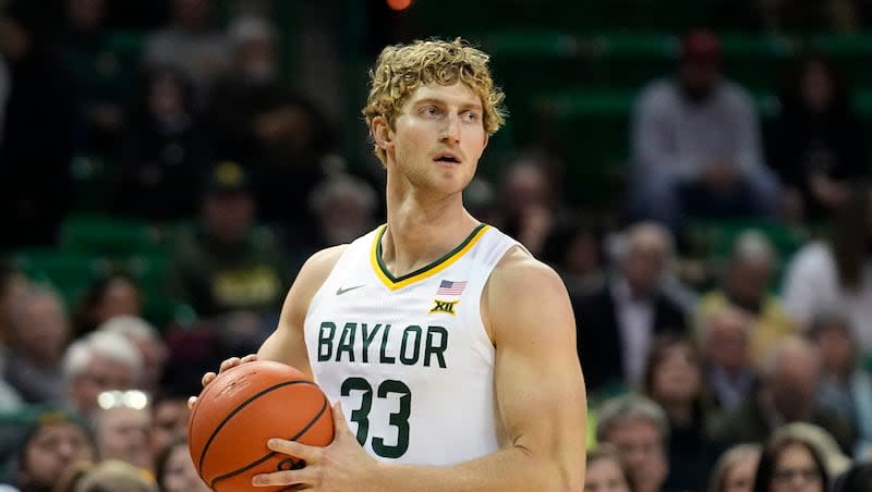Baylor forward Caleb Lohner (33) looks to pass during the first half of an NCAA college basketball game against Nicholls State in Waco, Texas, Tuesday, Nov. 28, 2023.