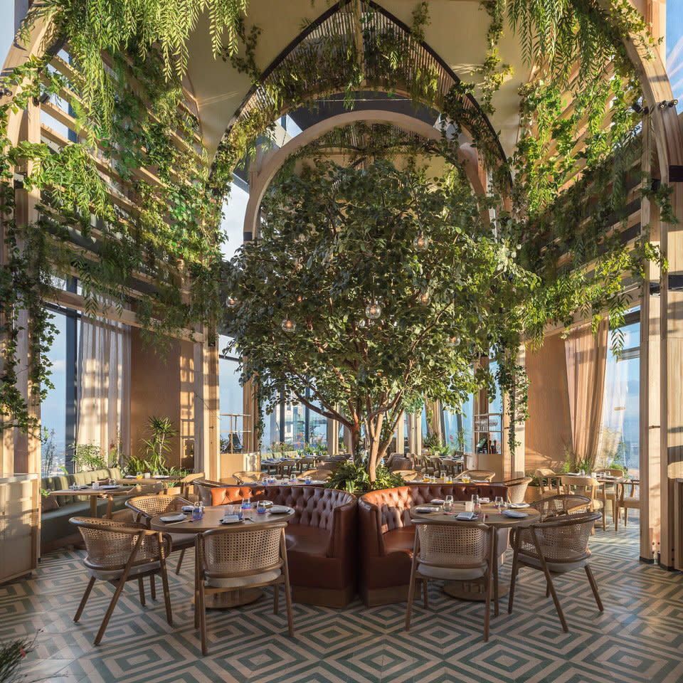 Plant-filled vaulted atrium of the Ling Ling Restaurant.