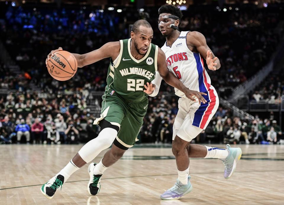 Bucks forward Khris Middleton drives for the basket against Pistons guard Hamidou Diallo in the second quarter on Monday, Jan. 3, 2022, in Milwaukee.