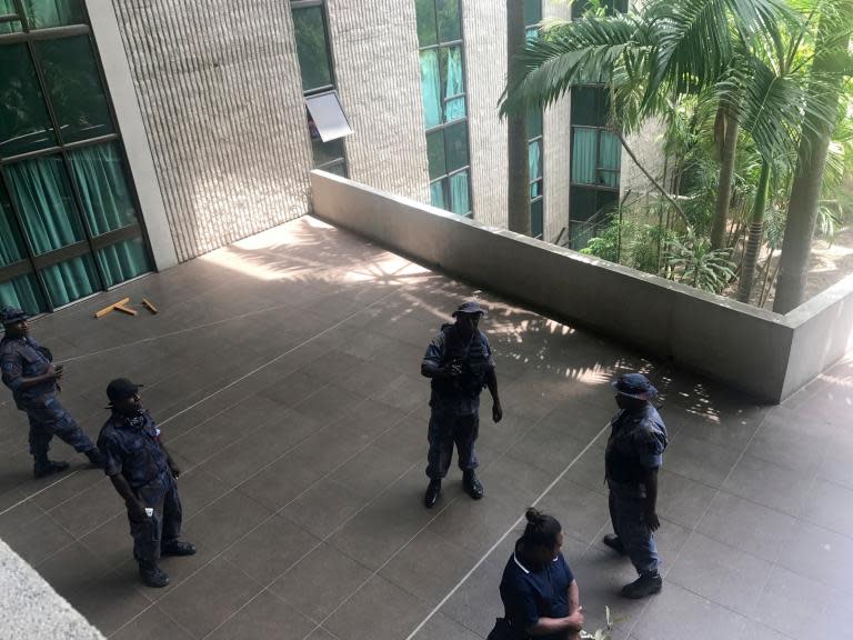 Off-duty police and soldiers storm Papua New Guinea's parliament to demand Apec summit pay