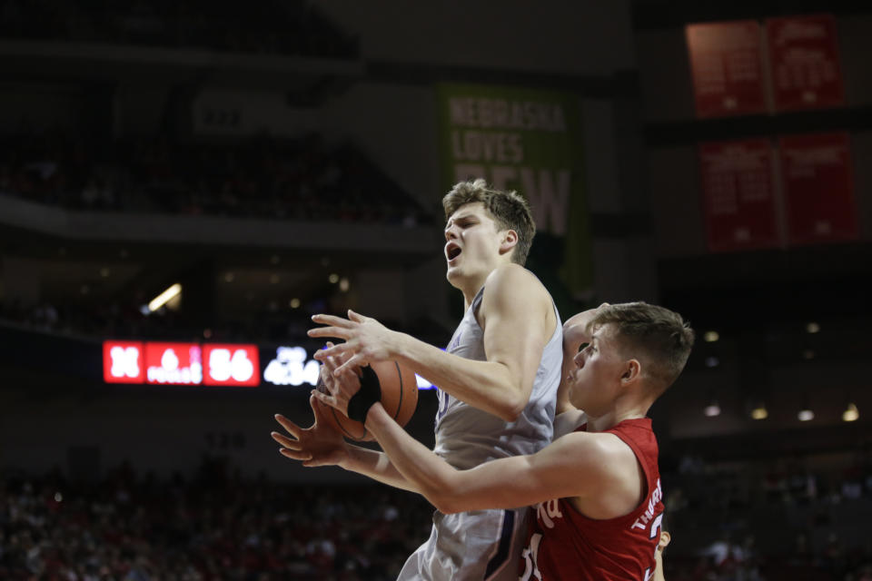 Northwestern's Miller Kopp loses control of the ball against Nebraska's Thorir Thorbjarnarson (34) during the second half of an NCAA college basketball game in Lincoln, Neb., Sunday, March 1, 2020. (AP Photo/Nati Harnik)