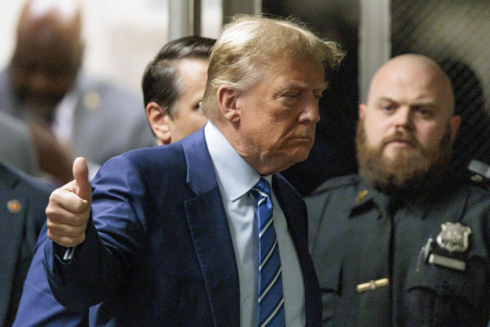 Former President Donald Trump returns to the courtroom after a short recess during the second day of jury selection at Manhattan criminal court, Tuesday, April 16, 2024, in New York. Donald Trump returned to the courtroom Tuesday as a judge works to find a panel of jurors who will decide whether the former president is guilty of criminal charges alleging he falsified business records to cover up a sex scandal during the 2016 campaign. (Justin Lane/Pool Photo via AP)