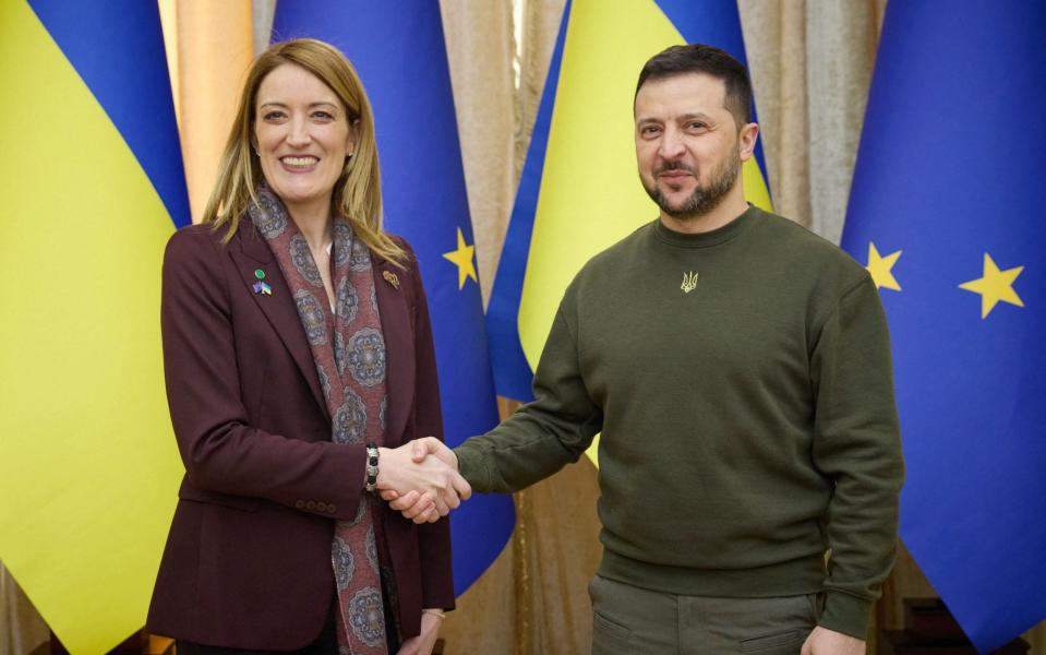 Volodymyr Zelensky and Roberta Metsola, the president of the European Parliament, at the conference - AFP