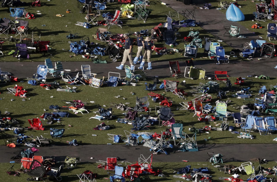 FILE - In this Oct. 4, 2017, file photo, agents from the FBI continue to process evidence at the scene of a mass shooting in Las Vegas. It was the deadliest mass shooting in modern U.S. history on the Las Vegas Strip in 2017. More than 100 people have been killed in mass shootings thus far in 2023, an average of one mass killing a week. (AP Photo/Gregory Bull, File)