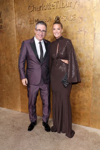 <p>Cindy Ord/Getty</p> John Oliver and Kate Norley