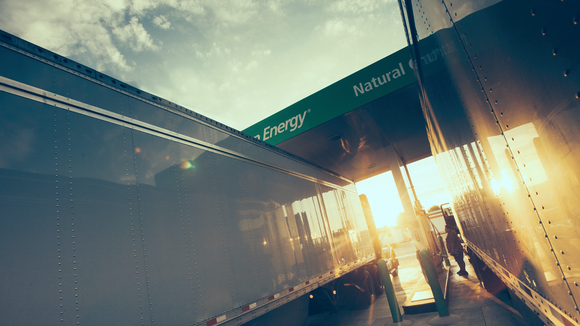 Class 8 trucks refueling at Clean Energy Fuels station.