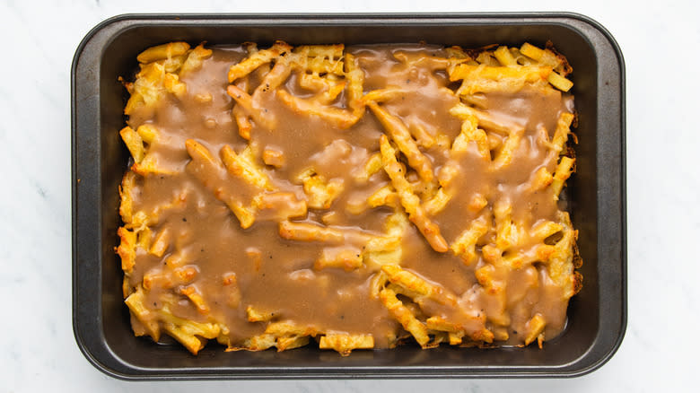 Disco fries with gravy in baking dish