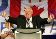 Toronto Mayor Rob Ford reacts on the podium during his campaign launch party in Toronto, April 17, 2014. Ford is seeking re-election in the Toronto municipal election, set for October 27, 2014.