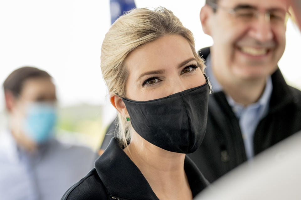 Ivanka Trump, the daughter of President Donald Trump, wears a mask as she speaks with employees following a tour of Coastal Sunbelt Produce, Friday, May 15, 2020, in Laurel, Md. (AP Photo/Andrew Harnik)