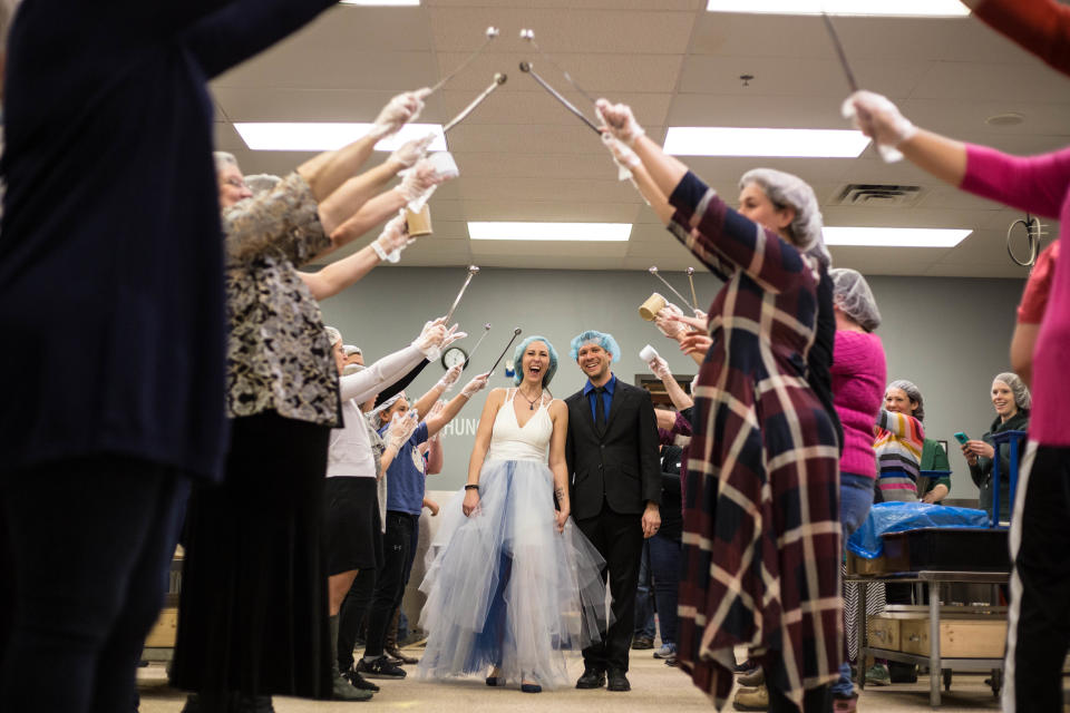 Guests formed a ladle arch for the newlyweds. (Photo: Courtesy of Feed My Starving Children)