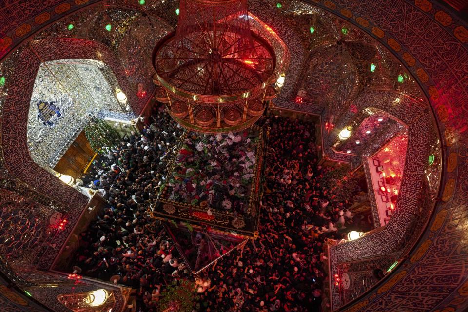 Shiite worshipers attend Laylat al-Qadr, or Qadr Night prayer during the holy Islamic month of Ramadan, in Najaf, Iraq, Tuesday, April 11, 2023 (AP Photo/Anmar Khalil)