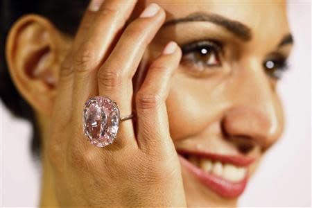 A model displays the 'Pink Star' 59.60 carat oval cut pink diamond at Sotheby's in Geneva September 25, 2013. REUTERS/Ruben Sprich