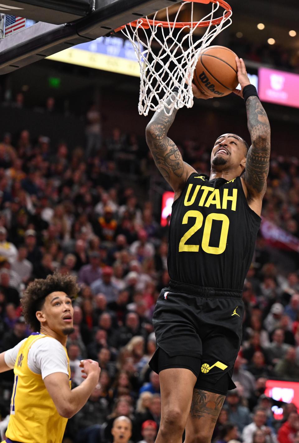 Utah Jazz forward John Collins (20) goes in for another dunk as the Utah Jazz and the Los Angeles Lakers play at the Delta Center in Salt Lake City on Wednesday, Feb. 14, 2024. | Scott G Winterton, Deseret News