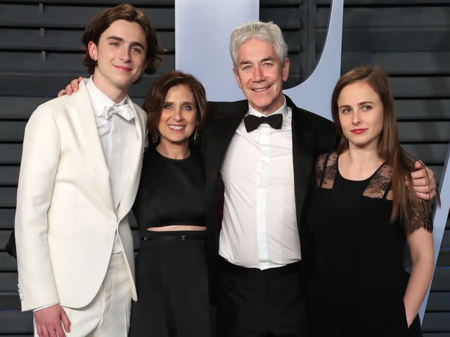 <p>Matt Baron/Shutterstock </p> Timothee Chalamet, Nicole Flender, Marc Chalamet and Pauline Chalamet at the Vanity Fair Oscar Party on March 4, 2018.