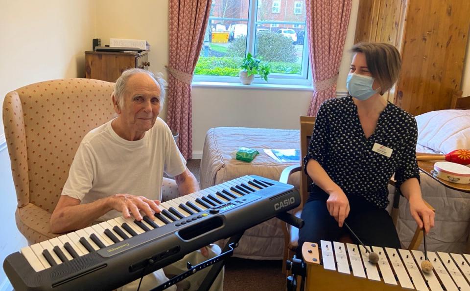 Resident Dennis Holman with music therapist Sarah Morgan (MHA/Casio/PA)