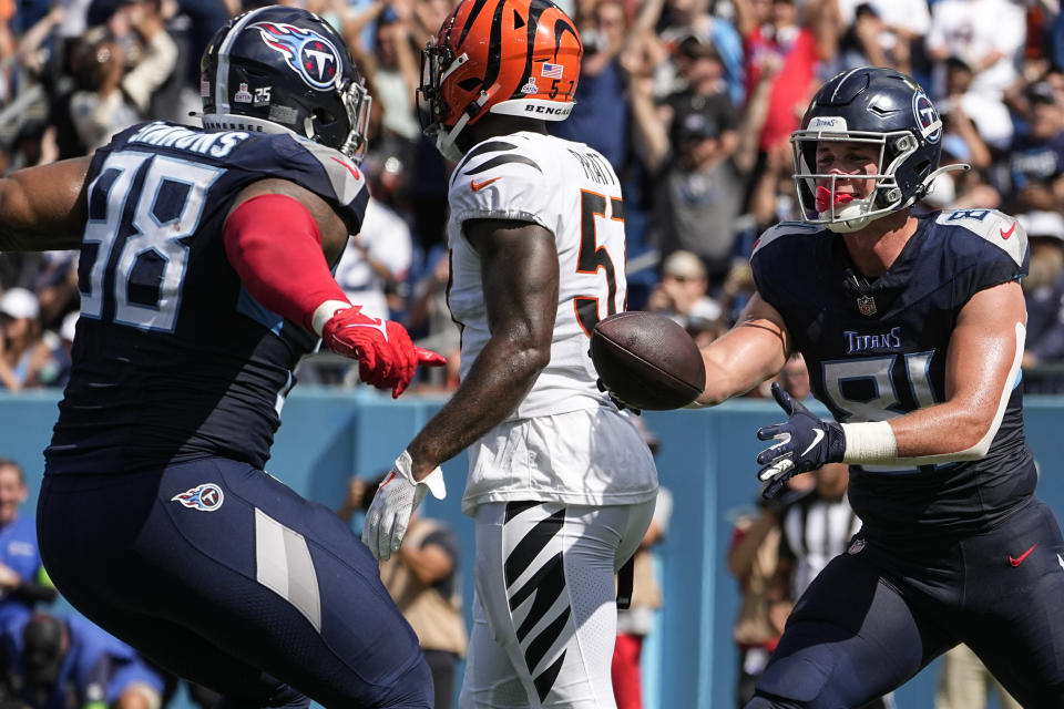 Tennessee Titans' Jeffery Simmons (98) and tight end Josh Whyle (81) celebrate a touchdown against the Cincinnati Bengals during the first half of an NFL football game, Sunday, Oct. 1, 2023, in Nashville, Tenn. (AP Photo/George Walker IV)
