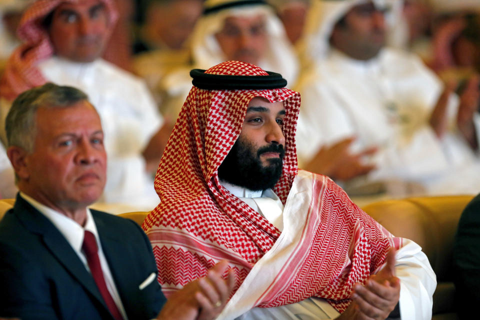 Saudi Crown Prince, Mohammed bin Salman, right, and Jordan's King Abdullah II, applaud at the Future Investment Initiative conference, in Riyadh, Saudi Arabia, Tuesday, Oct. 23, 2018.The high-profile economic forum in Saudi Arabia is the kingdom's first major event on the world stage since the killing of writer Jamal Khashoggi at the Saudi Consulate in Istanbul earlier this month. (AP Photo/Amr Nabil)