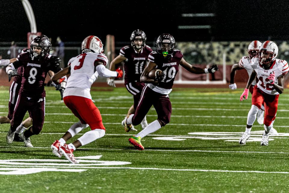 Appoquinimink's Dillon Griffith (19) returns a kickoff in Smyrna's 52-12 win over Appoquinimink.