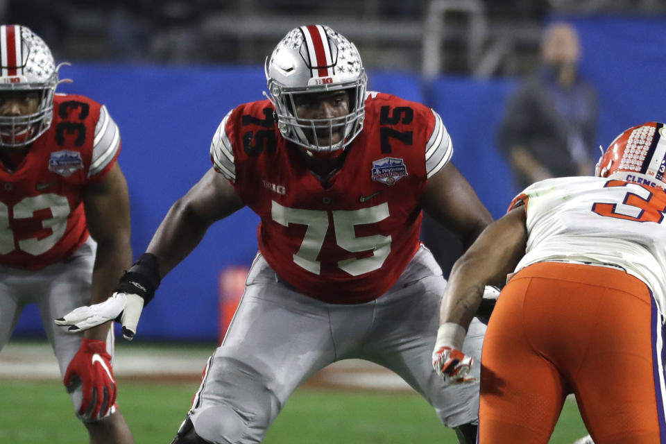 File-This Dec. 28, 2019, file photo shows Ohio State offensive lineman Thayer Munford (75) during the first half of the Fiesta Bowl NCAA college football game against Clemson in Glendale, Ariz. First-team All-Big Ten offensive tackle Munford, is returning for an extra year of eligibility. (AP Photo/Rick Scuteri, File)