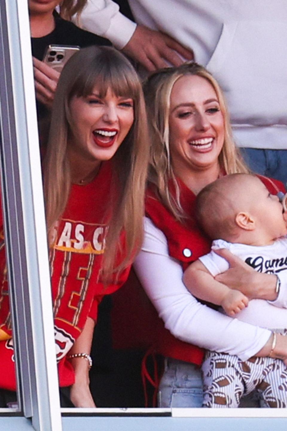 Big lols: Swift attends an American football game with new BFF Brittany Mahomes in October (Getty)