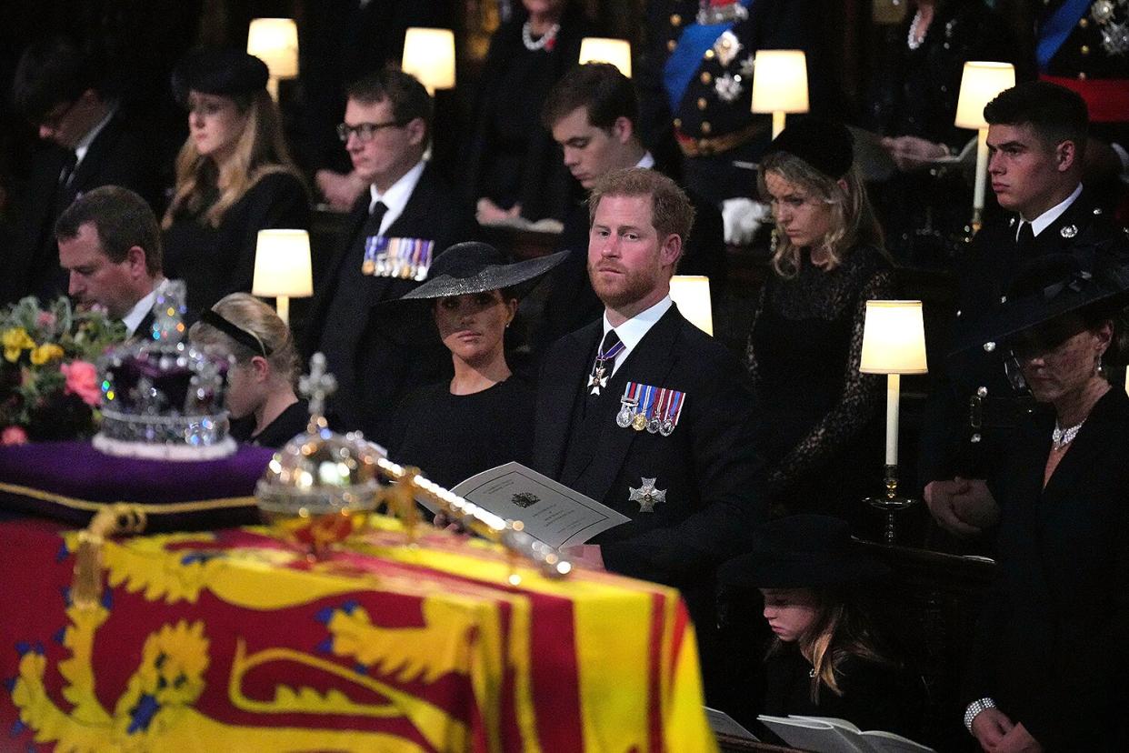 The Duchess of Sussex, the Duke of Sussex, Princess Charlotte, and the Princess of Wales during the Committal Service for Queen Elizabeth, at St George's Chapel in Windsor Castle on September 19, 2022 in Windsor, England.