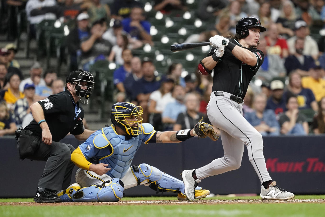 Arizona Diamondbacks' Jake McCarthy hits a two-run single during the third inning of a baseball game against the Milwaukee Brewers, Sunday, Sept. 22, 2024, in Milwaukee. (AP Photo/Aaron Gash)