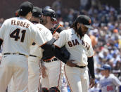 San Francisco Giants starting pitcher Johnny Cueto, right, walks off the mound as he was taken out during the sixth inning against the Los Angeles Dodgers in a baseball game Thursday, July 29, 2021, in San Francisco. (AP Photo/Tony Avelar)