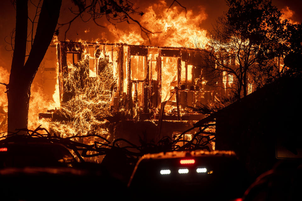 Flames consume a home as the Kincade Fire tears through the Jimtown community of Sonoma County, Calif., on Thursday, Oct. 24, 2019. (Photo: Noah Berger/AP)