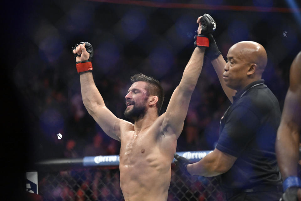 Mateusz Gamrot reacts after being declared the winner over Jalin Turner with a split decision in a UFC 285 mixed martial arts lightweight bout Saturday, March 4, 2023, in Las Vegas. (AP Photo/David Becker) ORG XMIT: NVDB106