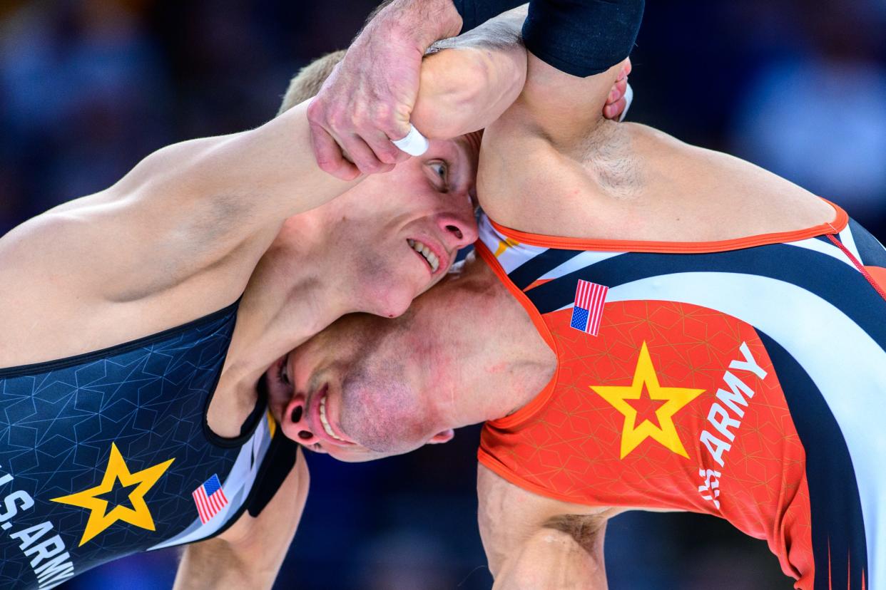 Dalton Roberts of Fowlerville (left) defeated Ildar Hafizov (right) to win the Greco-Roman 60-kilogram weight class at the wrestling U.S. Olympic Team Trials in State College, Pa.