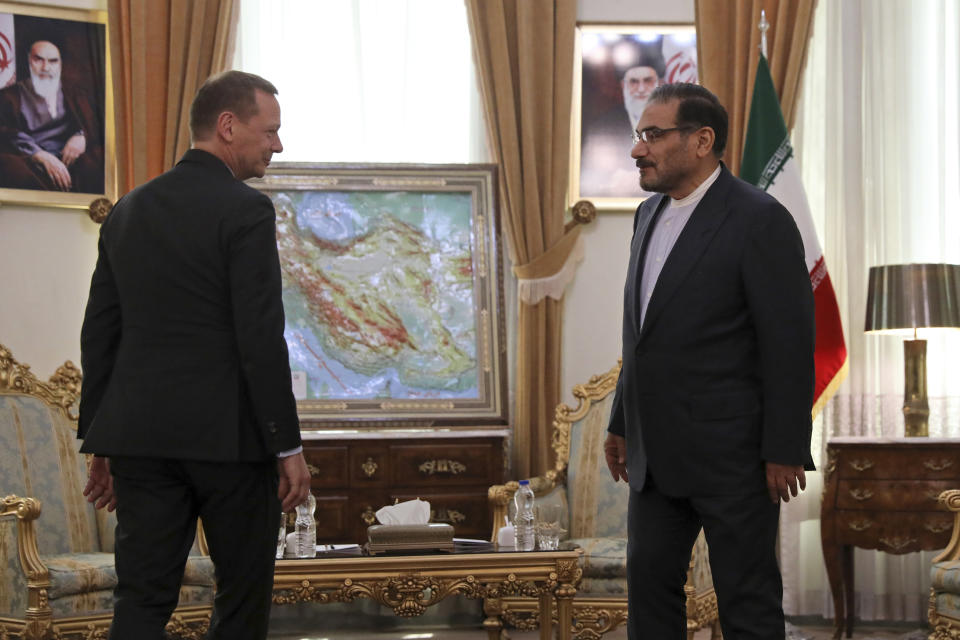French presidential envoy Emmanuel Bonne, left, is welcomed by Secretary of Iran's Supreme National Security Council Ali Shamkhani for a meeting in Tehran, Iran, Wednesday, July 10, 2019. (AP Photo/Vahid Salemi)