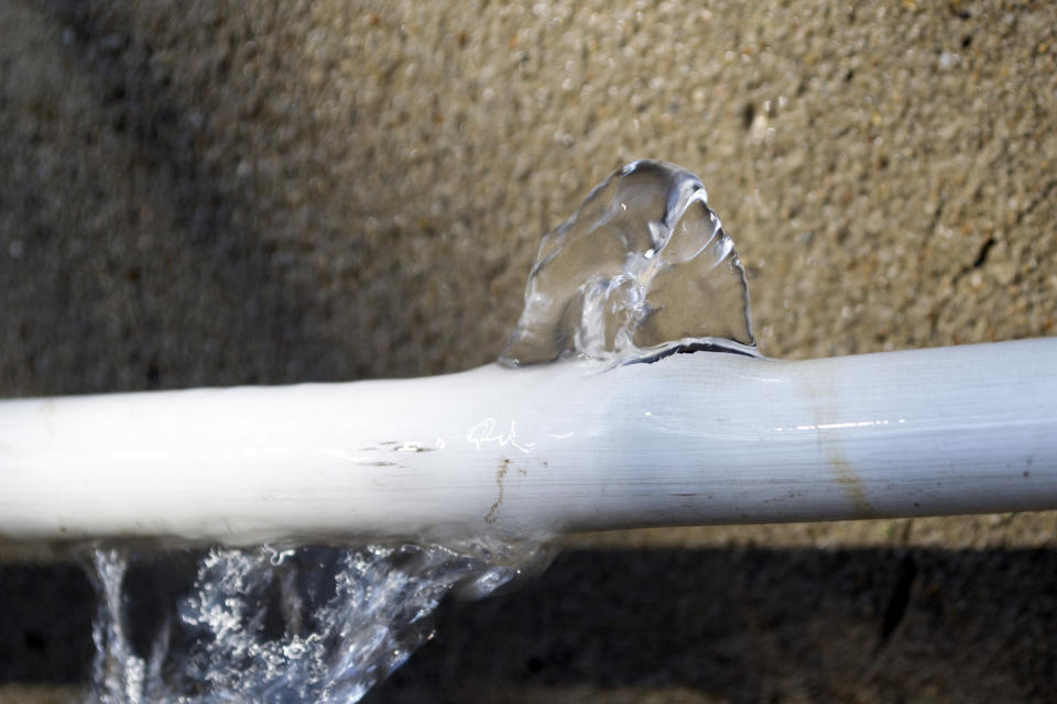 Burst pipe with water gushing out