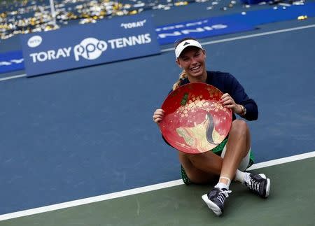 Tennis - Pan Pacific Open Women's Singles Final match - Ariake Coliseum, Tokyo, Japan - 25/09/16. Caroline Wozniacki of Denmark holds the winning plate during an awarding ceremony after winning the final match against Naomi Osaka of Japan. REUTERS/Issei Kato