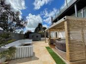 <p>From the hot tub to the seating area, this <a href="https://www.housebeautiful.com/uk/garden/designs/a495/garden-design-ideas/" rel="nofollow noopener" target="_blank" data-ylk="slk:garden;elm:context_link;itc:0;sec:content-canvas" class="link ">garden</a> is so dreamy! </p>