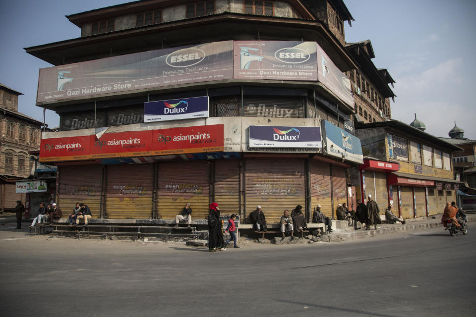 Kashmiris walk in a closed market area during a strike called by separatists in Srinagar, Indian controlled Kashmir, Saturday, Oct. 31, 2020. Kashmir’s main separatist grouping called the strike to protest new land laws that India enacted on Tuesday, allowing any of its nationals to buy land in the region. Pro-India politicians in Kashmir have also criticized the laws and accused India of putting Kashmir’s land up for sale. The move exacerbates concerns of Kashmiris and rights groups who see such measures as a settler-colonial project to change the Muslim-majority region’s demography. (AP Photo/Mukhtar Khan)