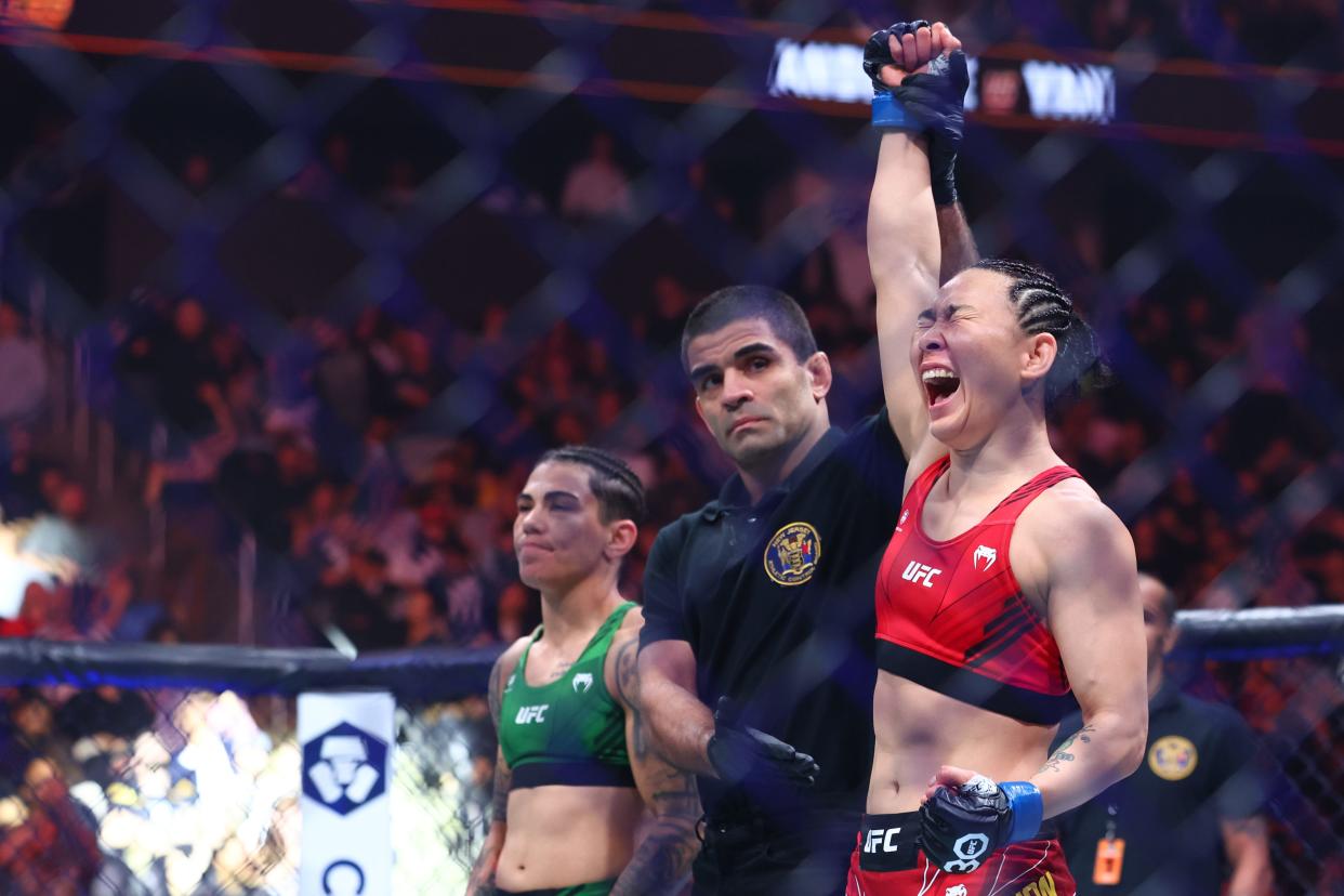 May 6, 2023; Newark, New Jersey, USA; Yan Xiaonan (blue gloves) react to defeating Jessica Andrade (red gloves) during UFC 288 at Prudential Center. Mandatory Credit: Ed Mulholland-USA TODAY Sports