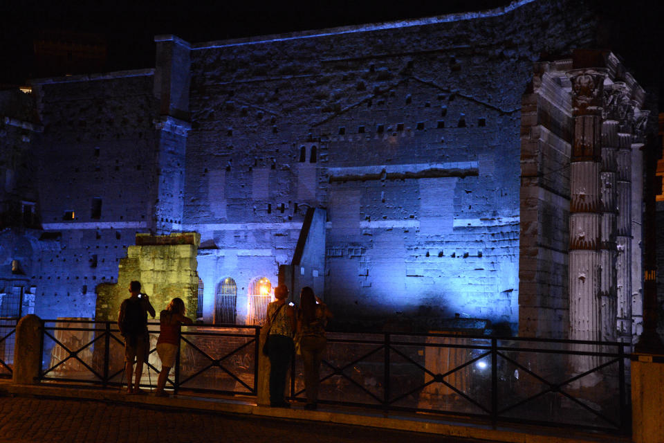 In this photo taken on Sept. 5, 2013, the Roman Forums by night are transformed into a romantic spot with white, blue and green beams of light coloring the ruins. The Way of the Imperial Forums, the street leading from Piazza Venezia to the Colosseum, is among the best-known places in Rome. (AP Photo/Michele Barbero)