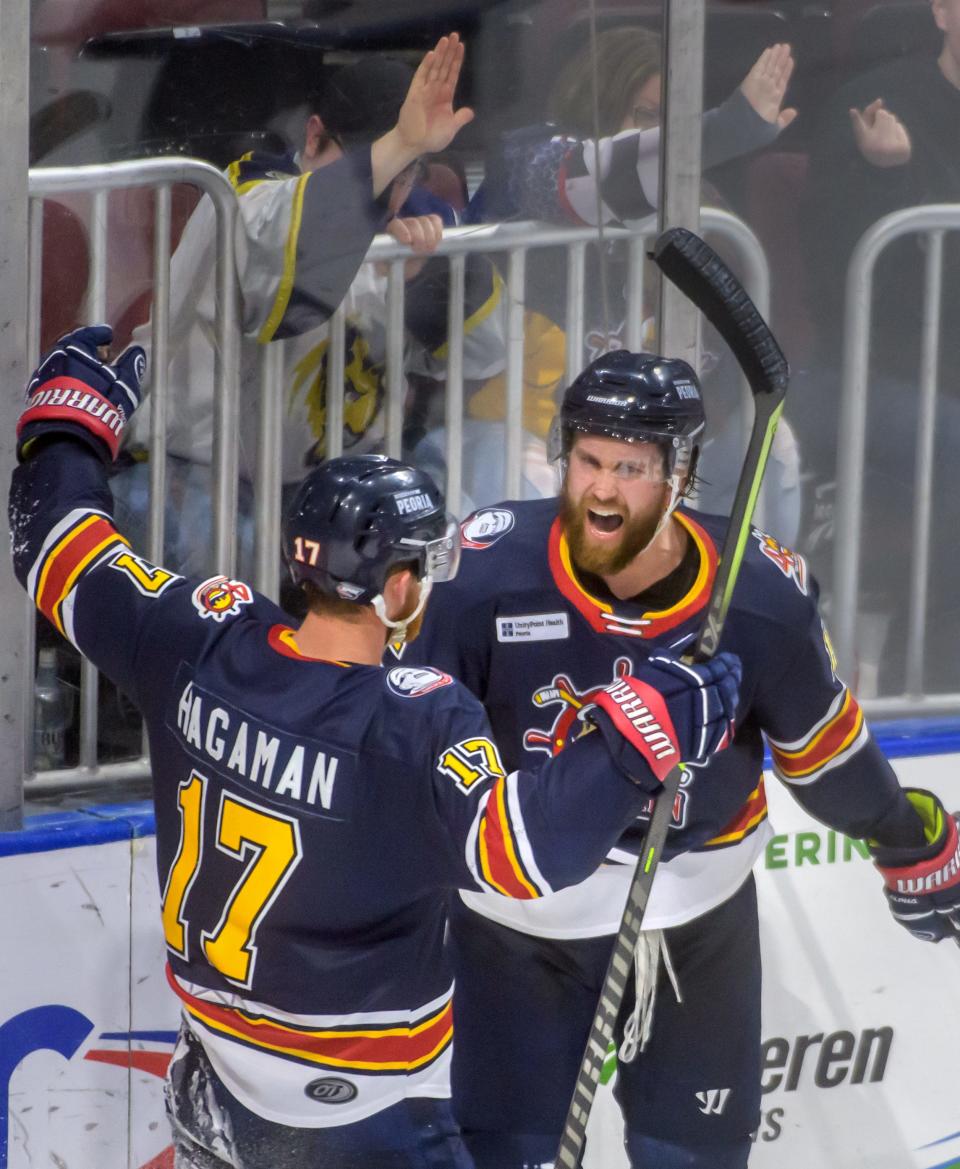 Peoria's Jordan Ernst, facing, and Alec Hagaman celebrate Ernst's goal against Pensacola in the third period of their SPHL playoff game Saturday, April 16, 2022 at Carver Arena. The Rivermen advanced to the second round with a 4-2 win.