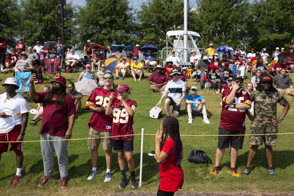 Washington Football Team fans watch drills during NFL football practice in Richmond, Va., Wednesday, July 28, 2021. (AP Photo/Ryan M. Kelly)