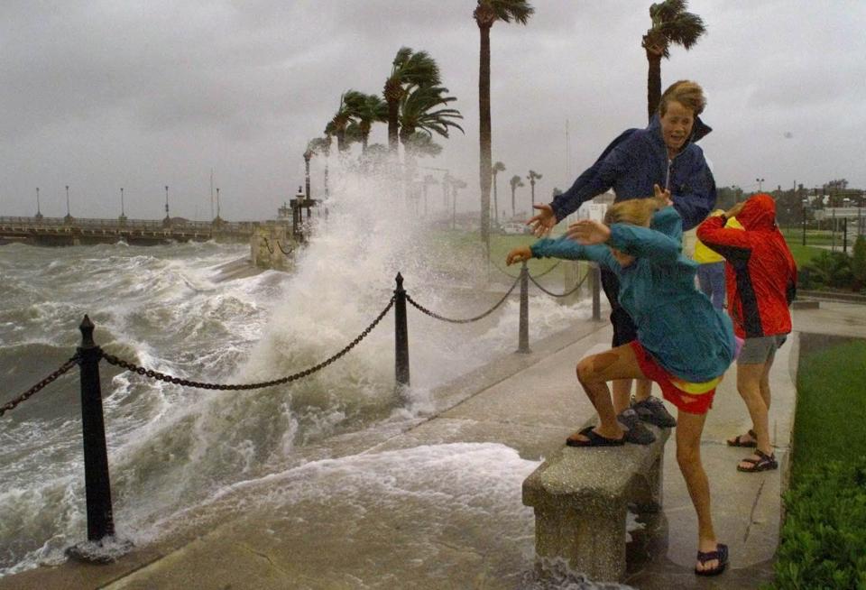 In St. Augustine wind-driven waves from Hurricane Floyd in 1999 smash into the bayfront seawall and, combined with high tide, flood nearby streets.
