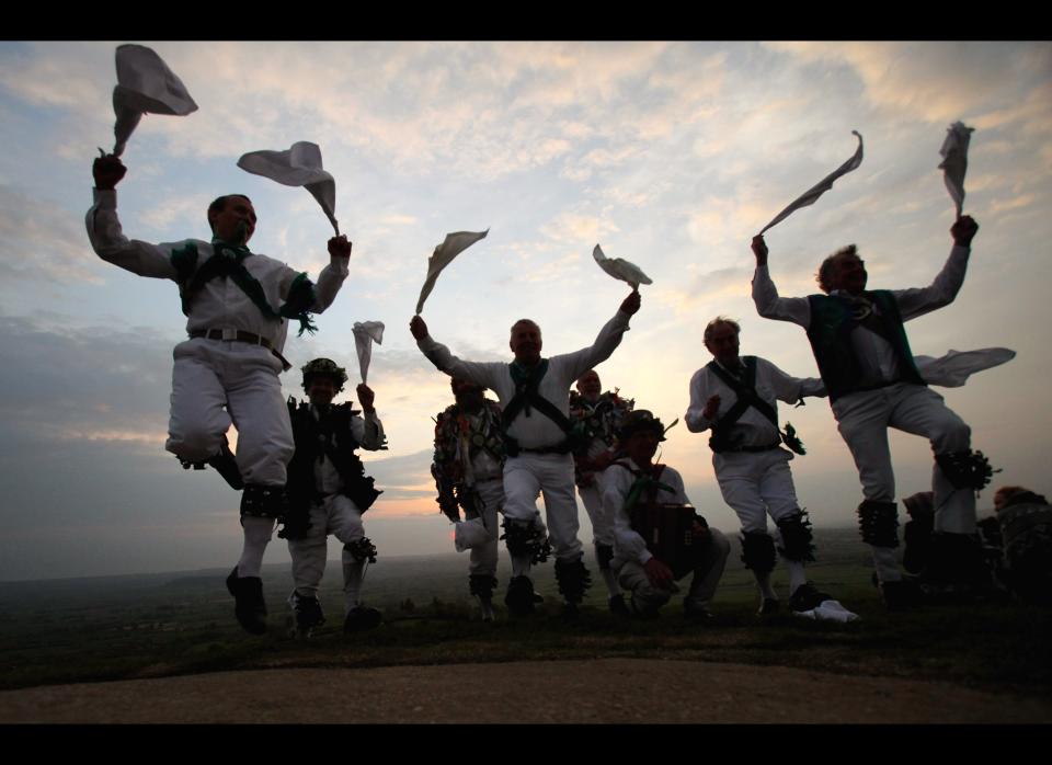 Morris Men dance at a May Day dawn celebration service in front of St. Michael's Tower on Glastonbury Tor on May 1, 2011 in Glastonbury, England.&nbsp;