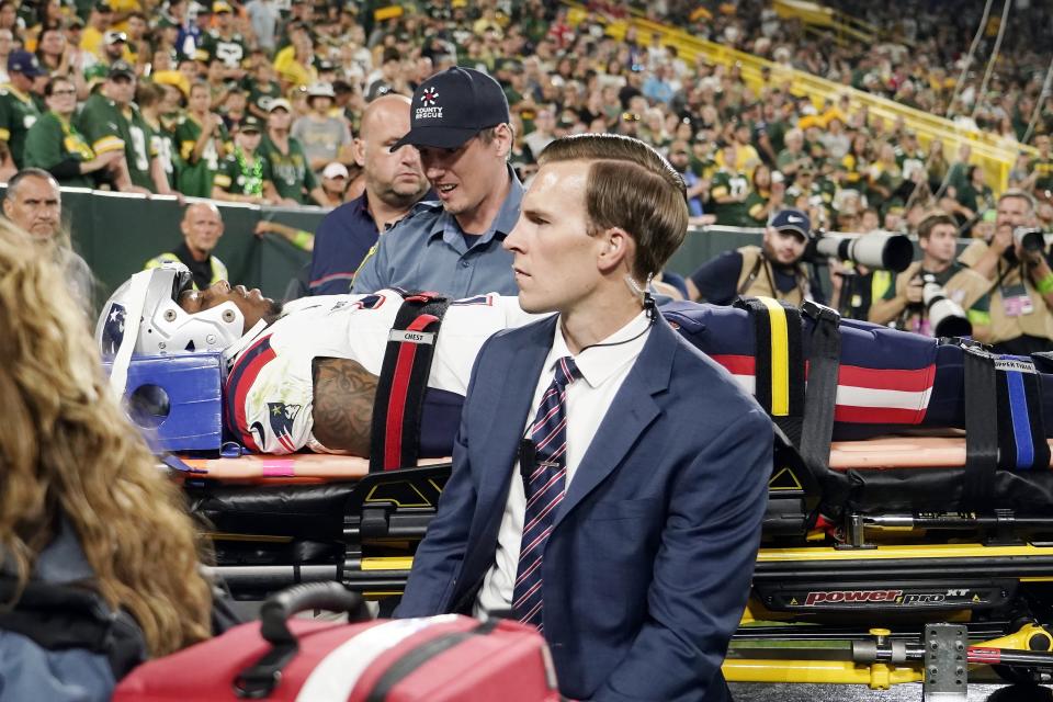 New England Patriots cornerback Isaiah Bolden is brought off the field after being injured during the second half of a preseason NFL football game against the Green Bay Packers, Saturday, Aug. 19, 2023, in Green Bay, Wis. The game was suspended after the injury. (AP Photo/Morry Gash)