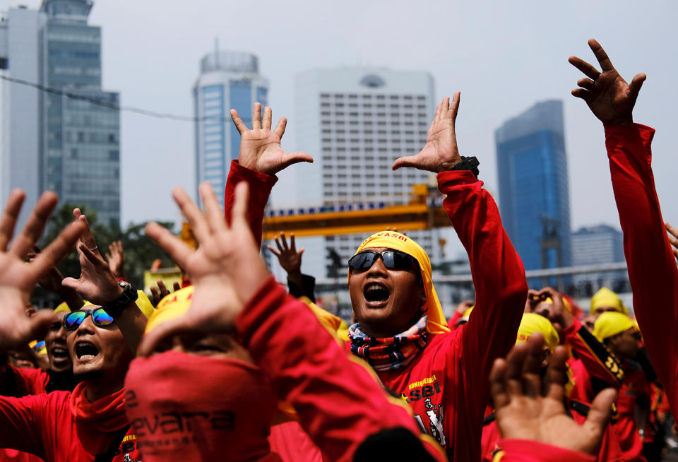 Indonesian workers shout slogans