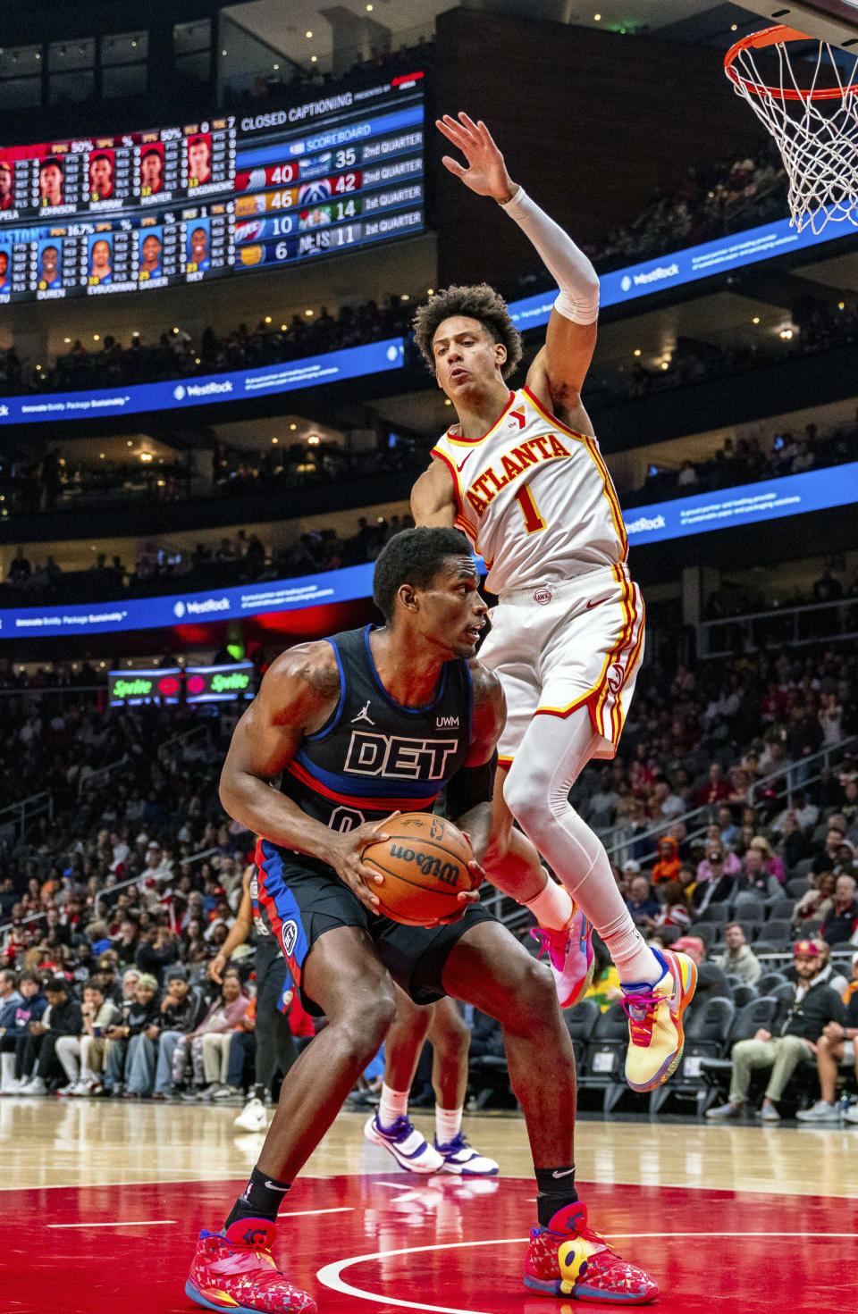 Detroit Pistons center Jalen Duren (0) goes to the basket against Atlanta Hawks forward Jalen Johnson (1) during the first half of an NBA basketball game, Wednesday, April 3, 2024, in Atlanta. (AP Photo/Jason Allen)