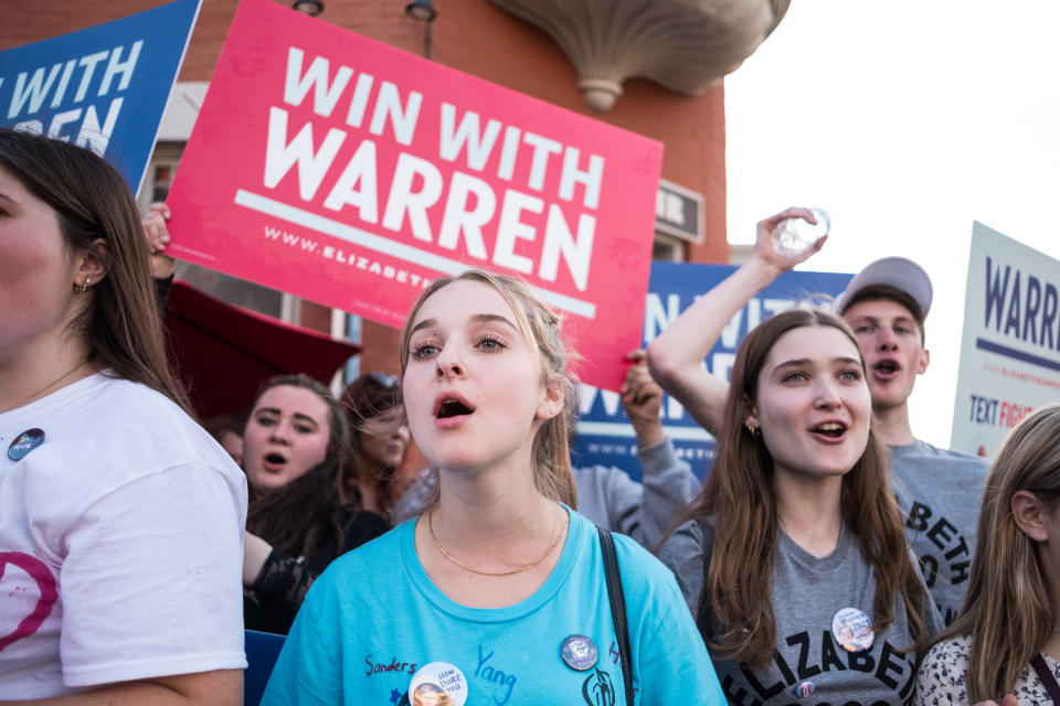 WESTERVILLE, UNITED STATES - 2019/10/15: Protesters shout slogans while holding placards during the democratic debate in support of Elizabeth Warren in Westerville. (Photo by Megan Jelinger/SOPA Images/LightRocket via Getty Images)